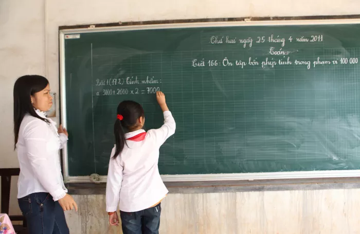 A student and her teacher in primary school