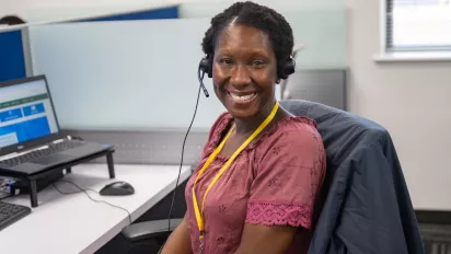 Smiling switchboard operator in a new call centre