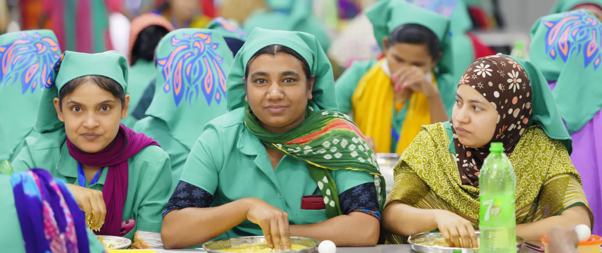 3 women at lunch break in factory